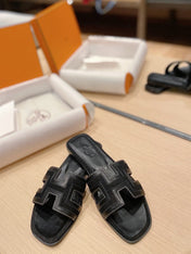 0RAN SANDALS IN BLACK CALFSKIN AND CANVAS
