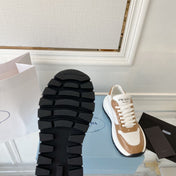 PRADA 25S THICK SOLE SNEAKER IN WHITE AND BROWN CALFSKIN