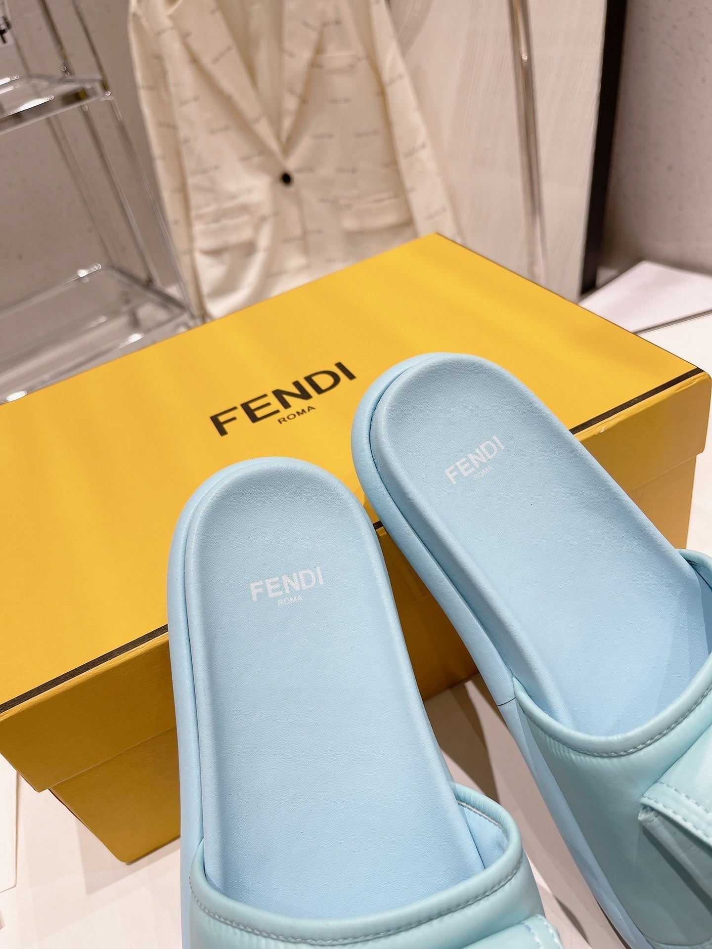 FENDI BAGUETTE SLIPPERS IN SKY BLUE LAMBSKIN WITH GOLD HARDWARE