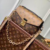 POCHETTE MÉTIS EAST WEST 21.5 IN BROWN MONOGRAM COATED CANVAS AND CALFSKIN