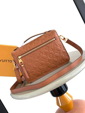 POCHETTE MÉTIS 25 IN COGNAC MONOGRAM EMPREINTE LEATHER GOLD HARDWARE