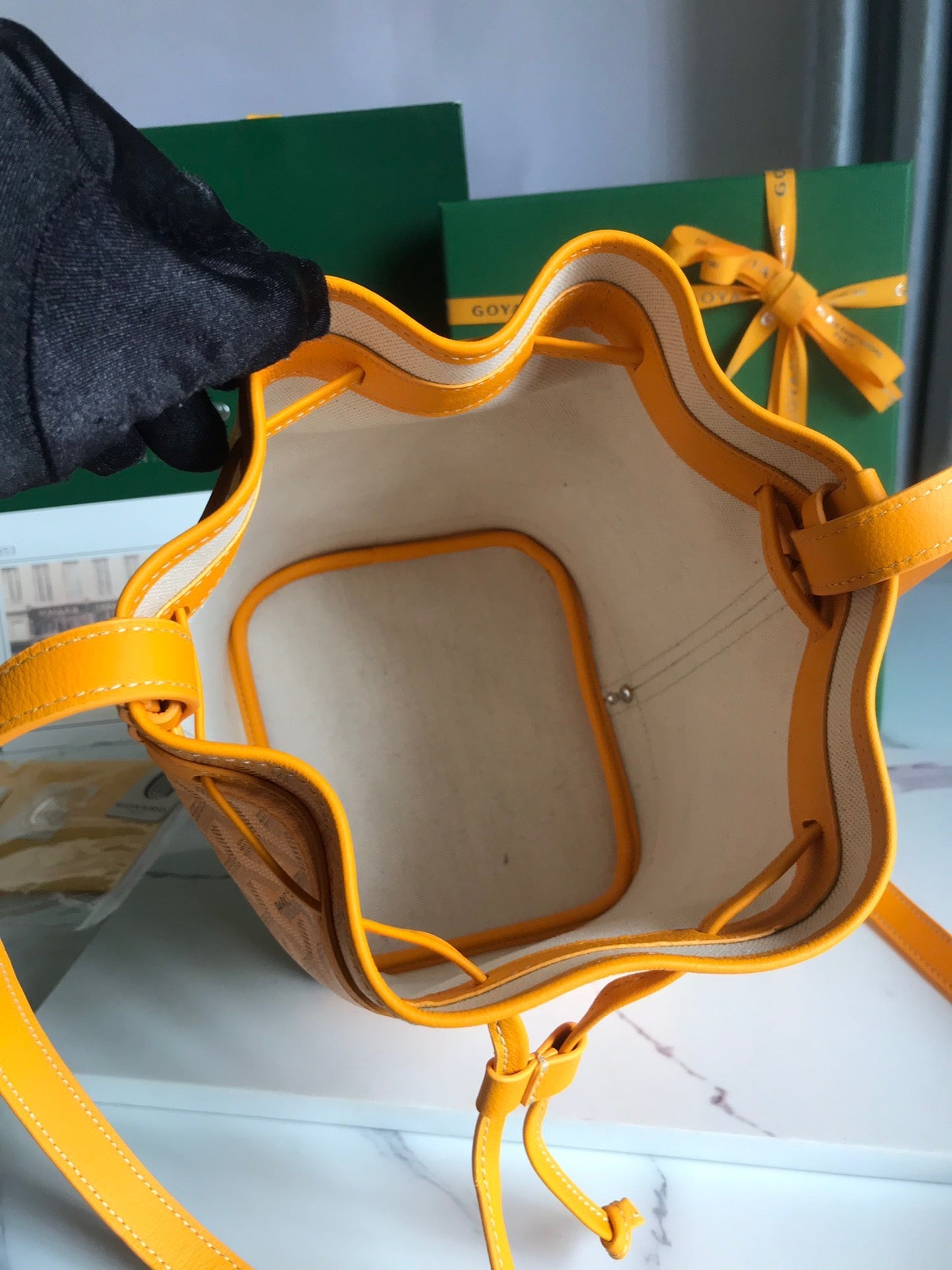 PETIT FLOT BUCKET BAG 22 IN YELLOW GOYARDINE CANVAS AND LAMBSKIN TRIM