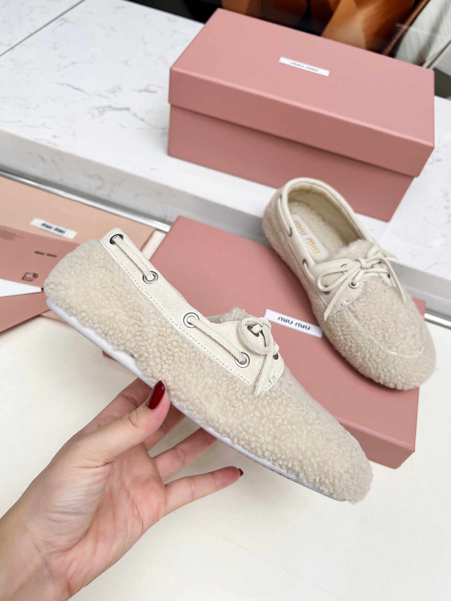MIUMIU 26S BOAT LOAFERS IN BEIGE SHEARLING
