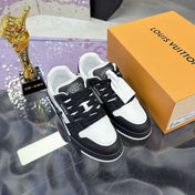LV TRAINER SNEAKERS IN BLACK AND WHITE CALFSKIN