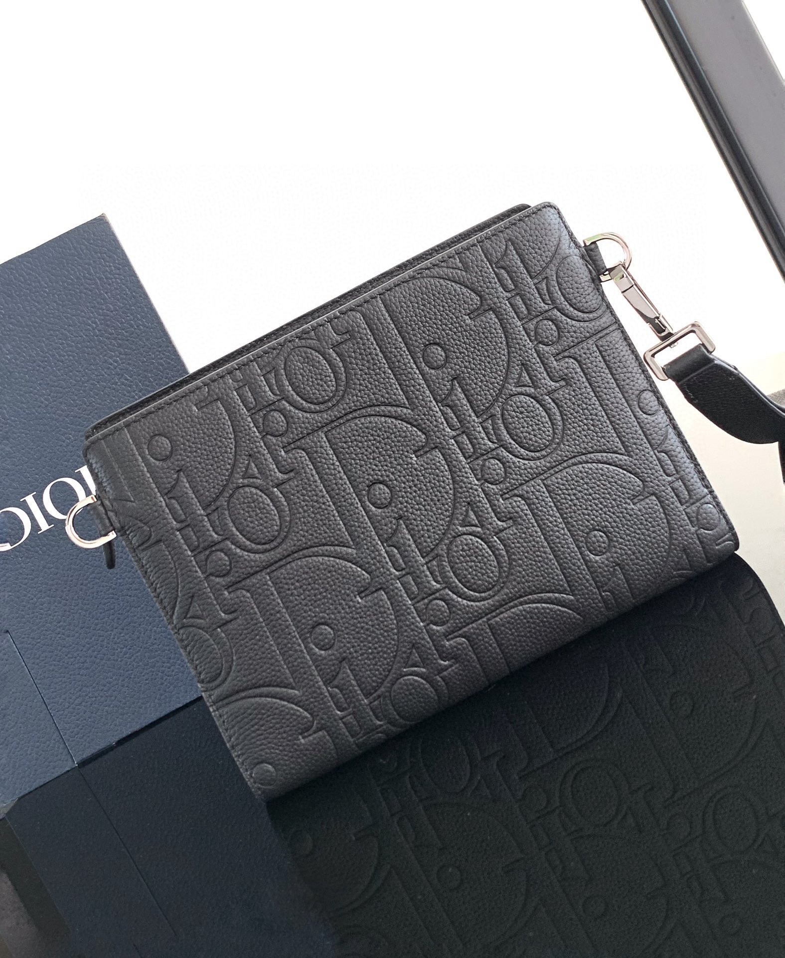 CLUTCH 27 BAG IN BLACK CALFSKIN EMBOSSED LOGO