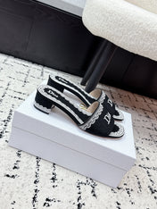 DIOR 26S HIGH HEEL SLIDES IN BLACK AND WHITE EMBOSSED OBLIQUE LACE EMBROIDERY