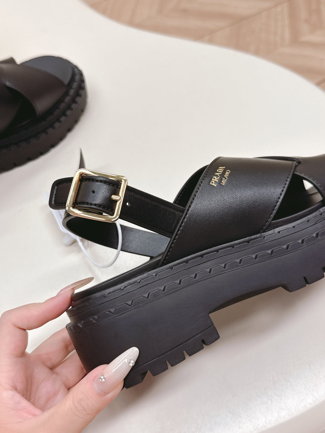PRADA 25S CRISSCROSS SANDALS IN BLACK CALFSKIN