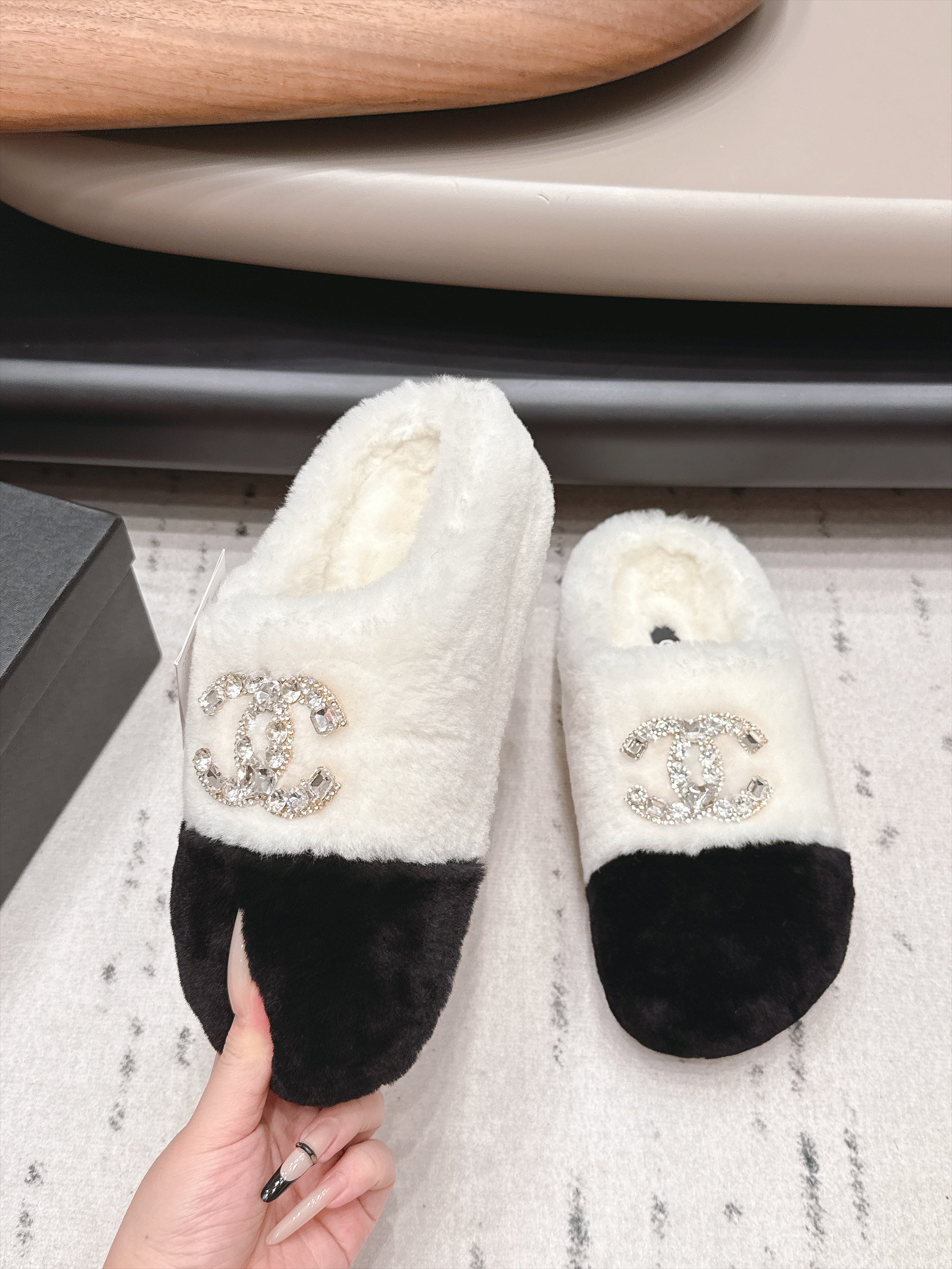 CHANEL 26S MULES IN BLACK AND WHITE SHEARLING WITH ROUND TOE