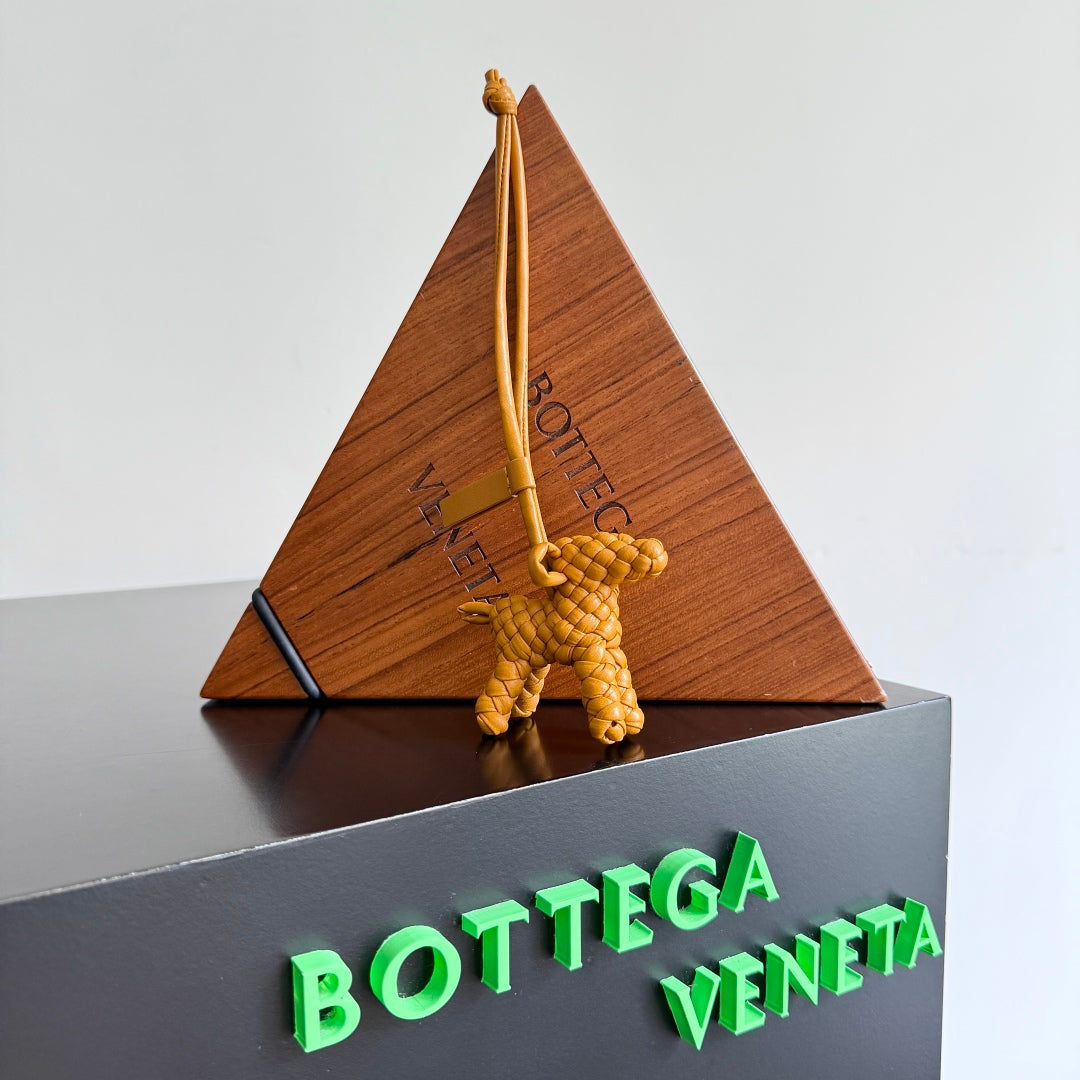 BOTTEGA VENETA 25S DOG CHARM IN BURNT ORANGE CALFSKIN