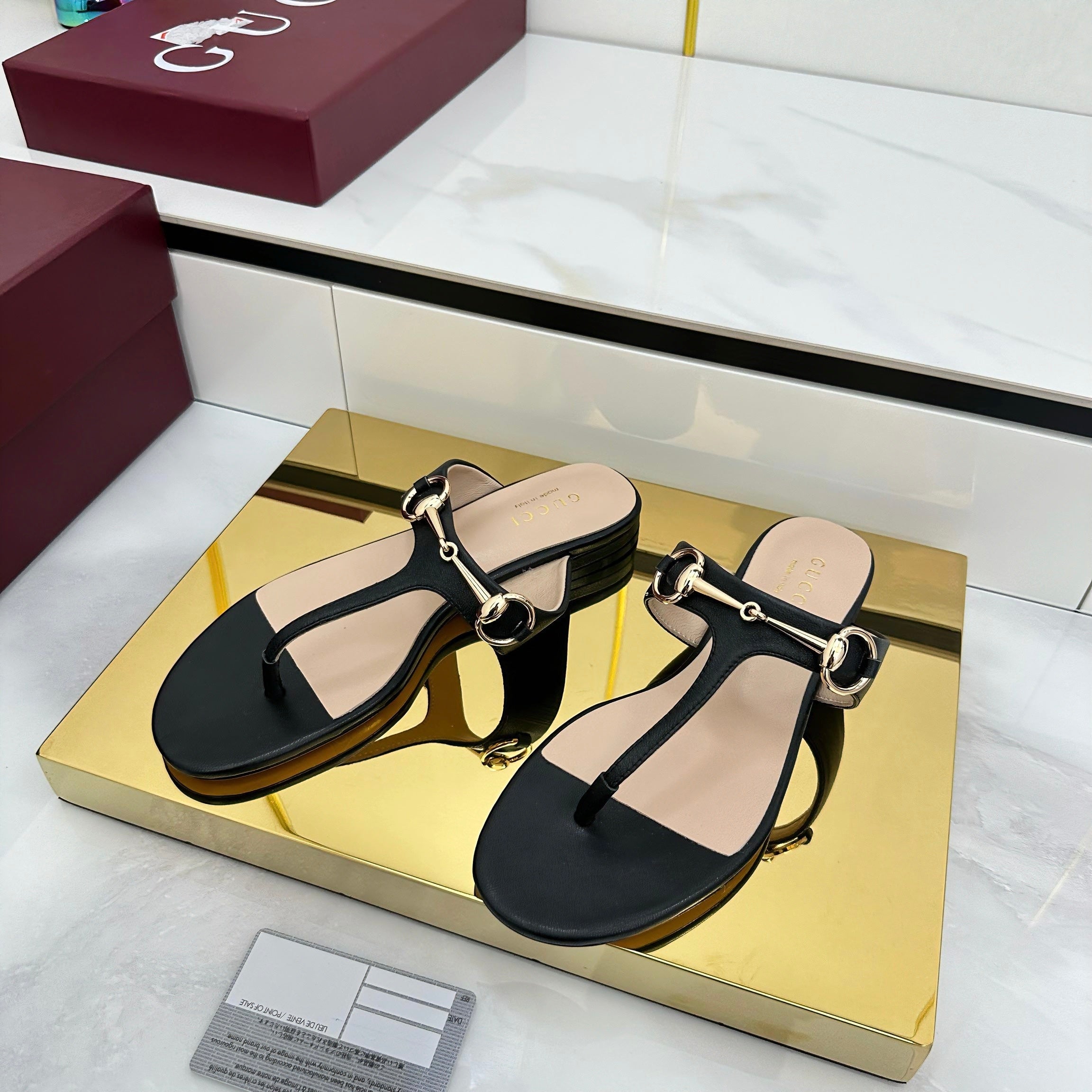 THONG SANDALS IN BLACK LAMBSKIN WITH GOLD HARDWARE