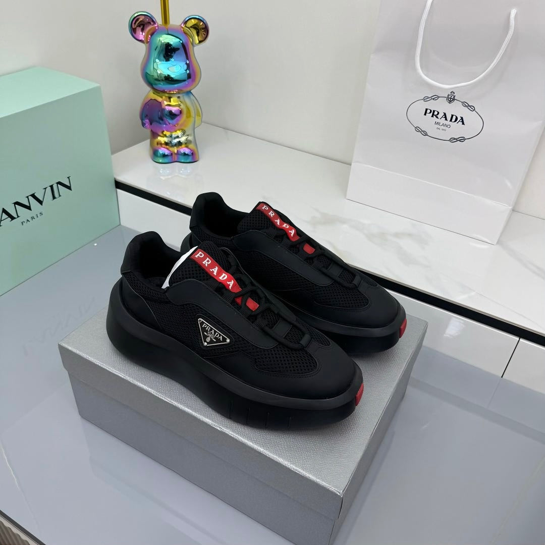 PRADA 25S CROSS LACED SNEAKERS IN BLACK CALFSKIN