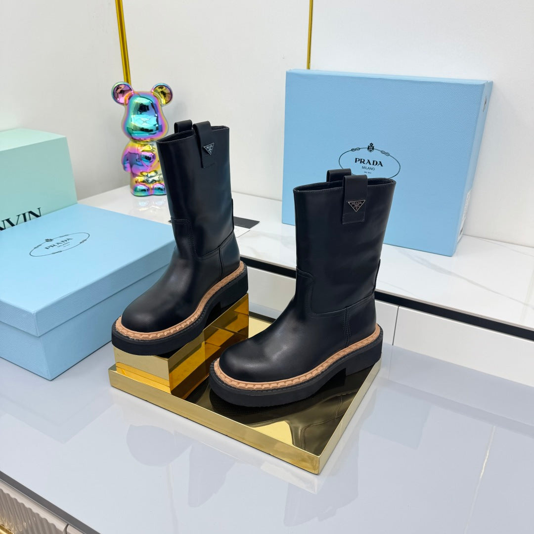 PRADA 25S HIGH MARTIN BOOTS 50MM IN BLACK CALFSKIN