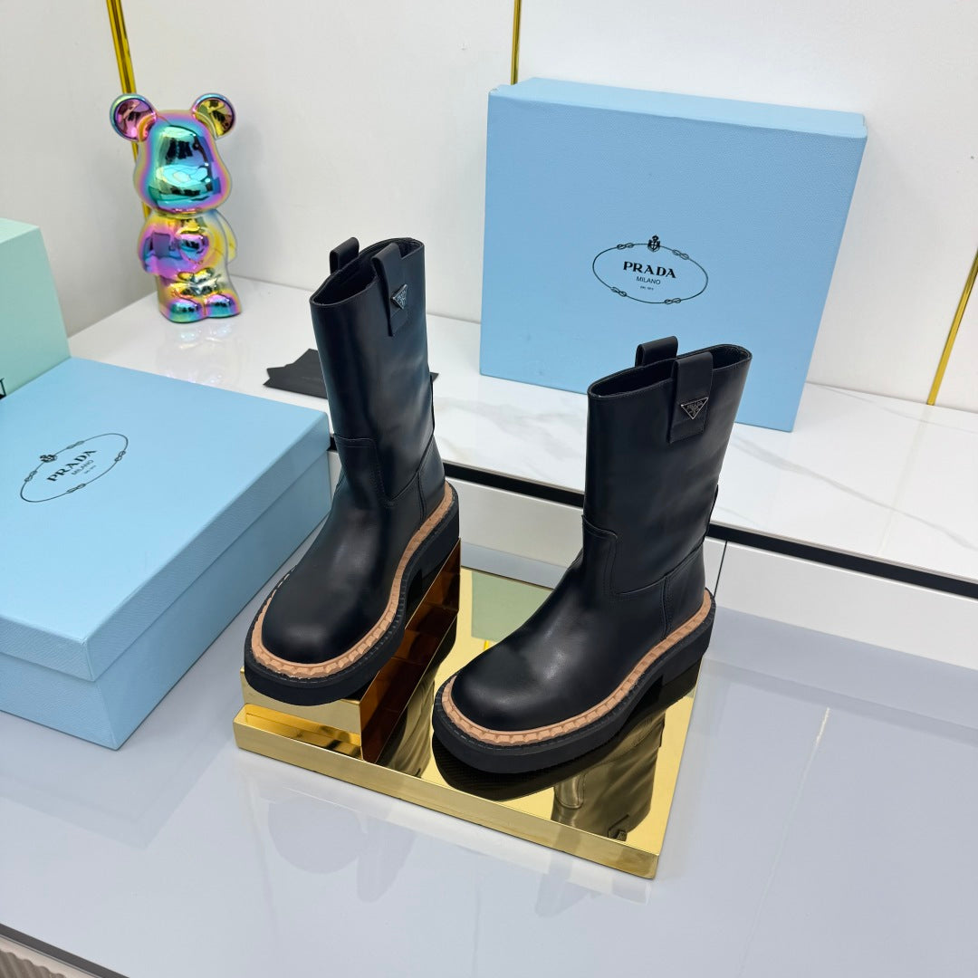 PRADA 25S HIGH MARTIN BOOTS 50MM IN BLACK CALFSKIN
