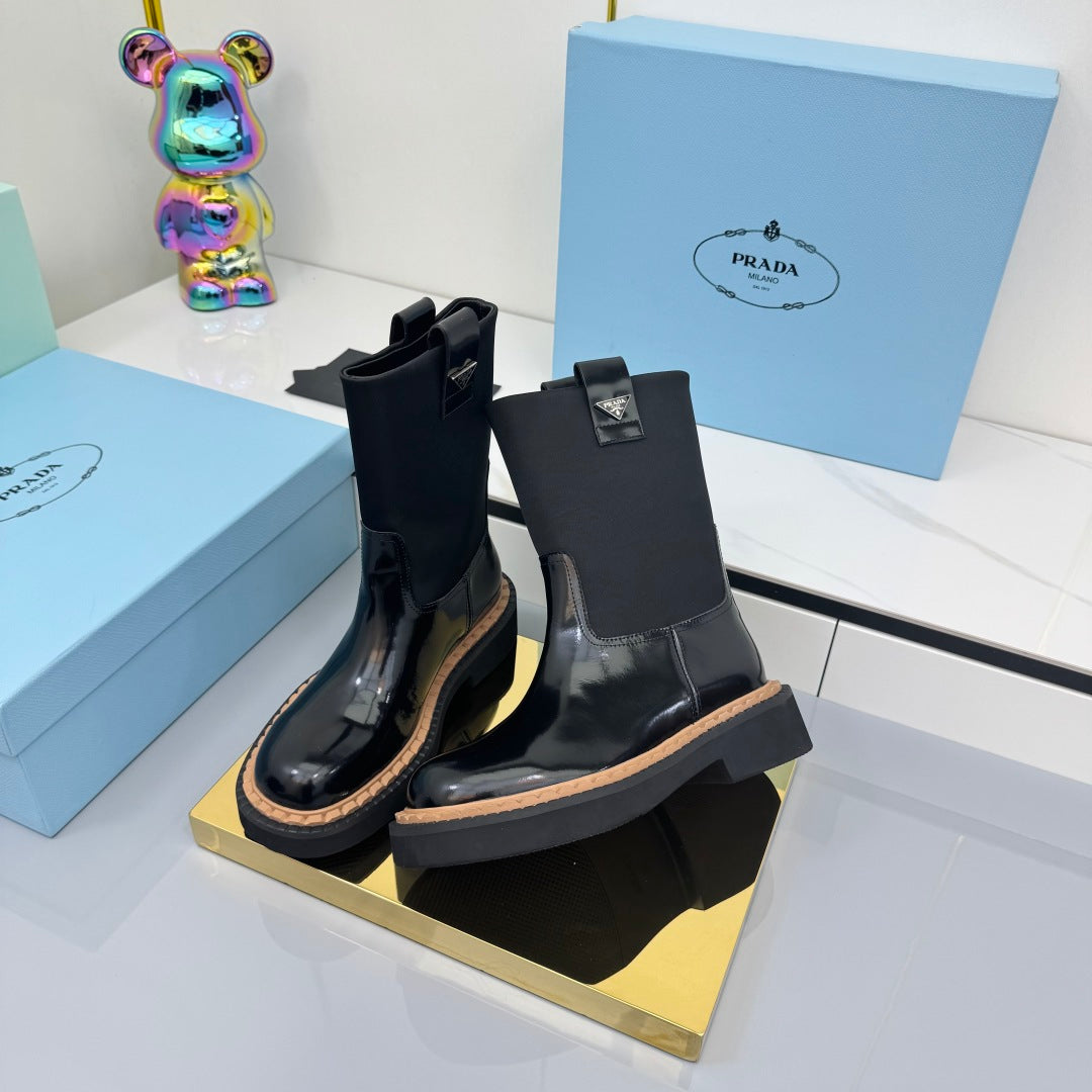 PRADA 25S HIGH MARTIN BOOTS 50MM IN BLACK GLOSSY CALFSKIN