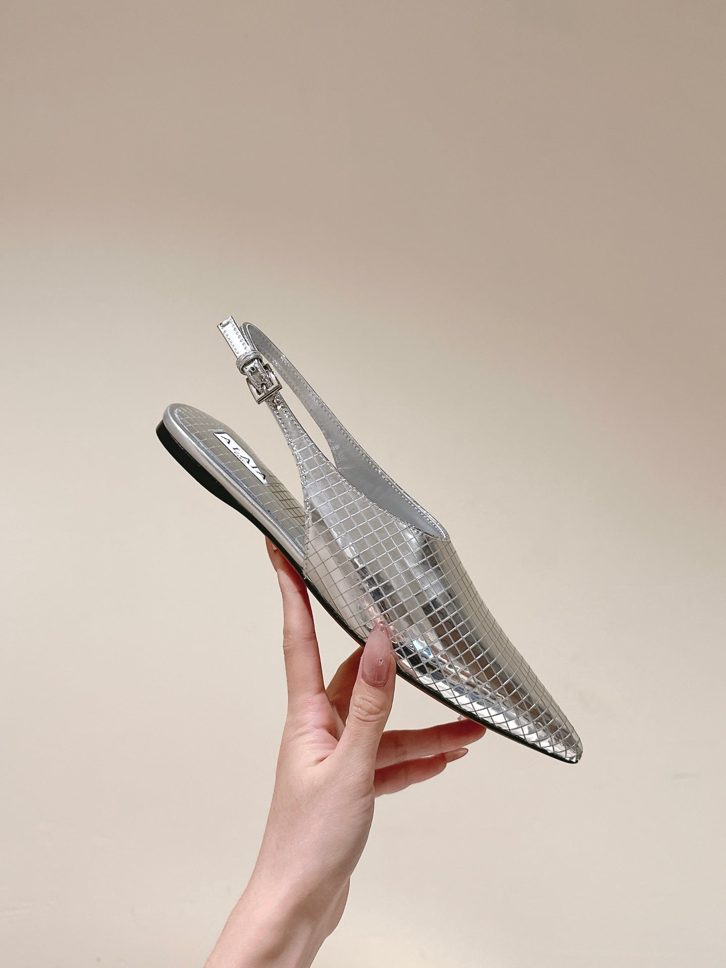 ALAIA SLINGBACK 25S IN SILVER PATENT LEATHER