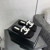 CHANEL 26S SLIDE SANDALS IN BLACK SHEARLING AND WHITE CC LOGO SQUARE TOE