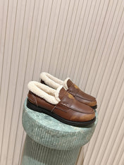 MIUMIU 25S PENNY LOAFERS 20MM IN EBONY BROWN BLEACHED CALFSKIN WITH SHEARLING