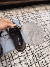 PRADA 26S BUCKLED LOAFERS IN DARK BROWN SHINY CALFSKIN