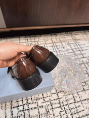 PRADA 26S BUCKLED LOAFERS IN DARK BROWN SHINY CALFSKIN