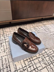 PRADA 26S BUCKLED LOAFERS IN DARK BROWN SHINY CALFSKIN