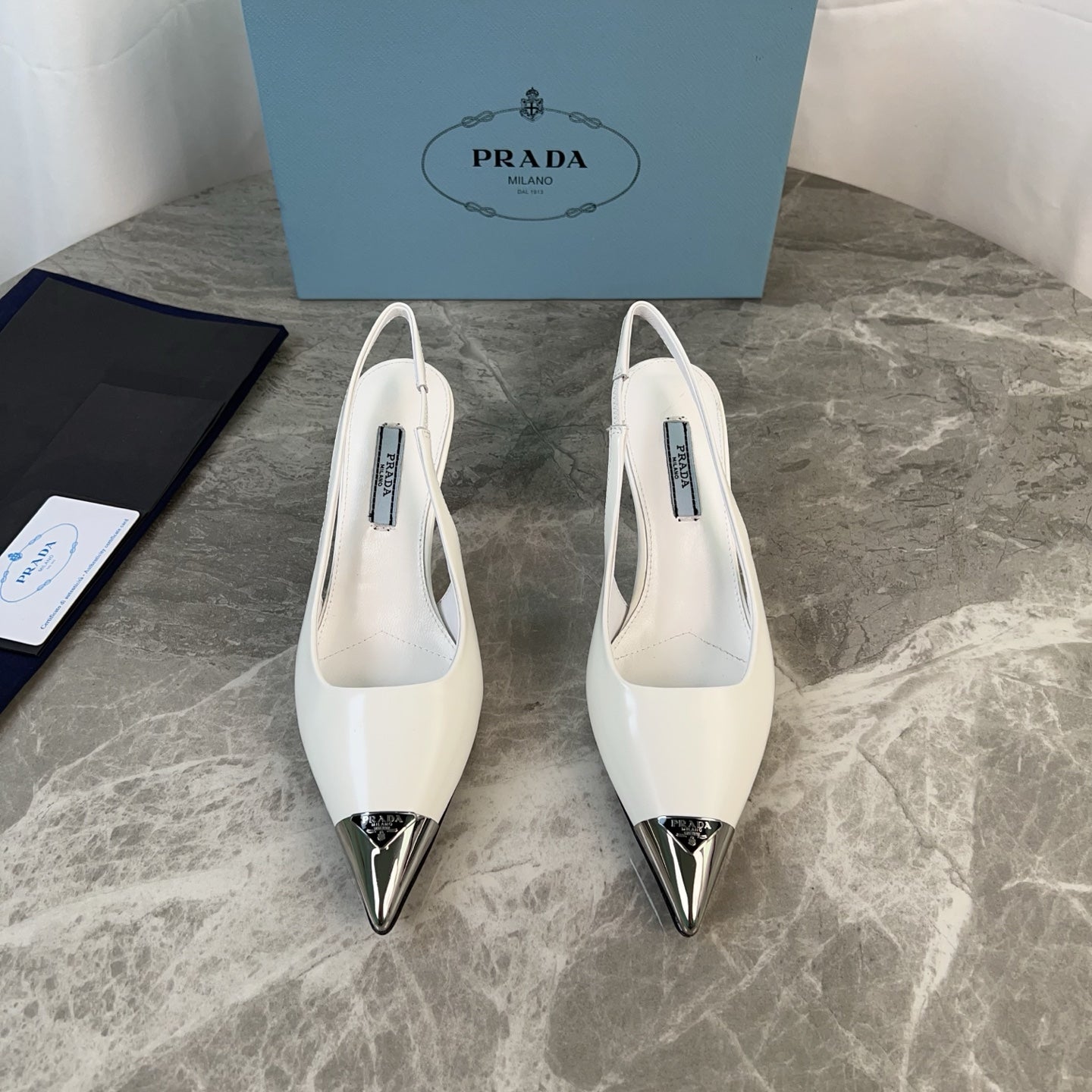 PRADA 25S METAL-TOE SLINGBACK PUMPS IN WHITE CALFSKIN