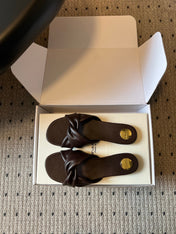 YSL 26S TWISTED-STRAP FLAT SANDALS IN DARK BROWN LAMBSKIN
