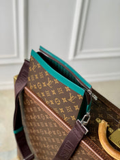 GASTON WEARABLE WALLET 18 IN BROWN MONOGRAM CANVAS MIX GREEN CALFSKIN
