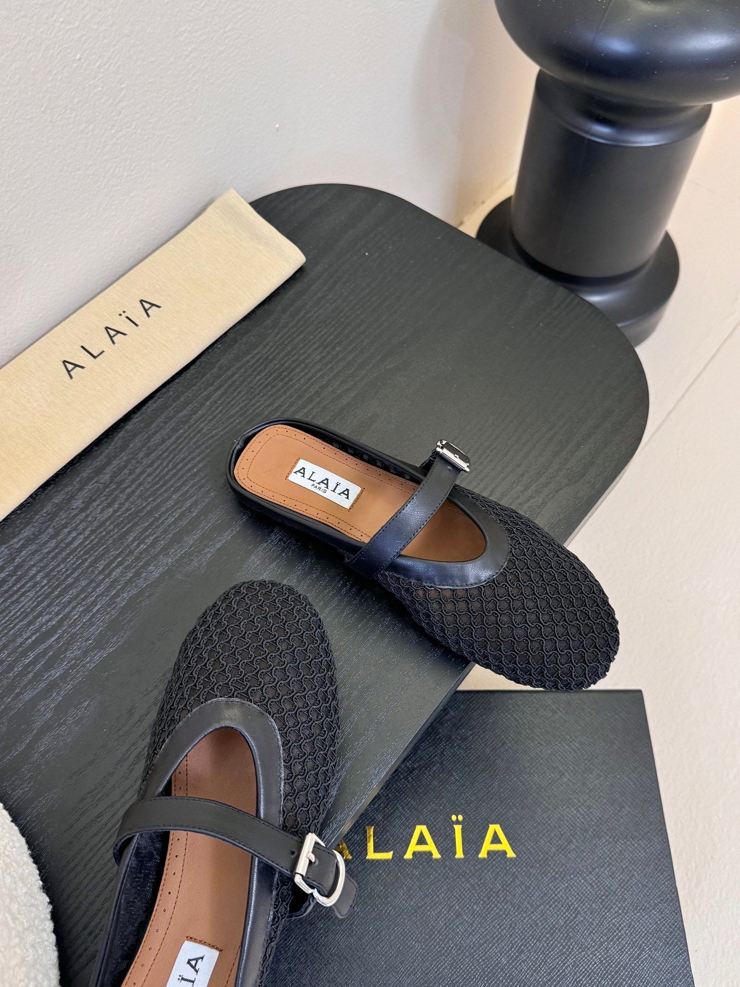 ALAIA FLAT MULES 25S IN BLACK WOVEN MESH
