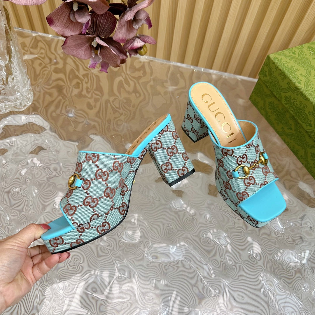 HORSEBIT SLIDE SANDAL IN SKY BLUE MONOGRAM CANVAS AND SHEEPSKIN LINING