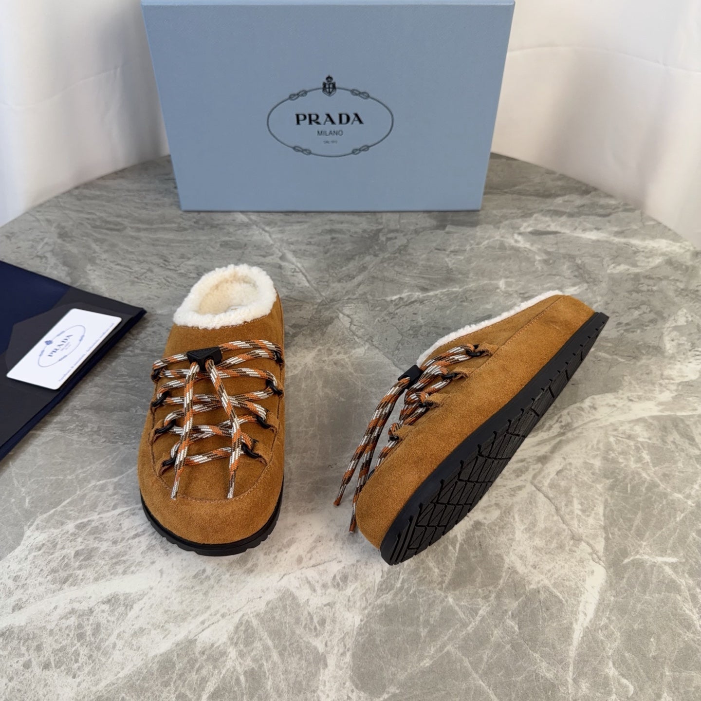 PRADA 26S WOVEN MULES IN COGNAC BROWN SUEDE