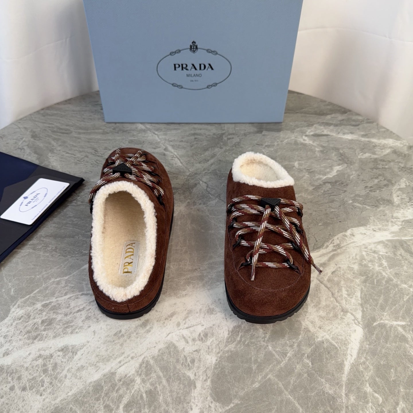 PRADA 26S WOVEN MULES IN DARK BROWN SUEDE