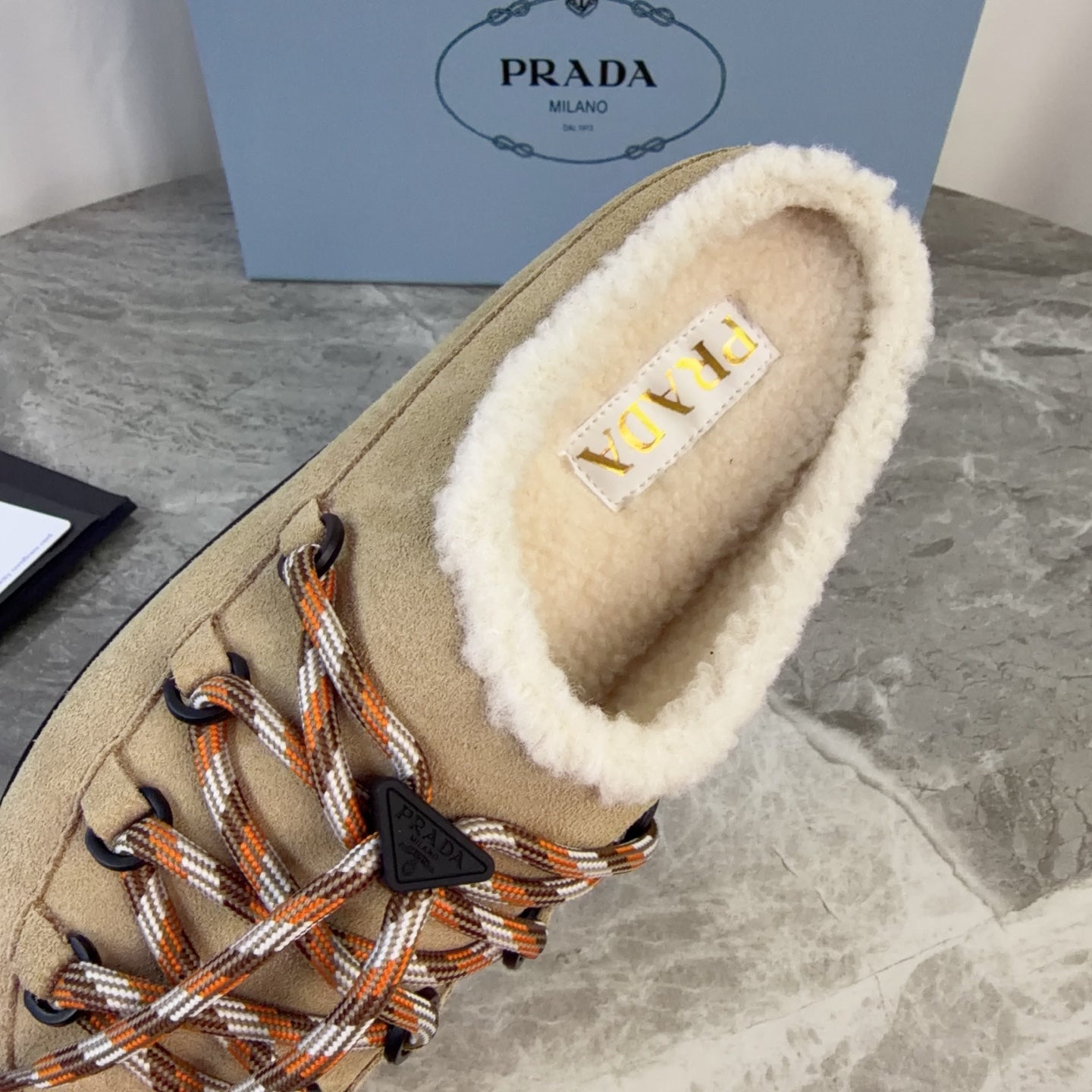 PRADA 26S WOVEN MULES IN DARK BEIGE SUEDE