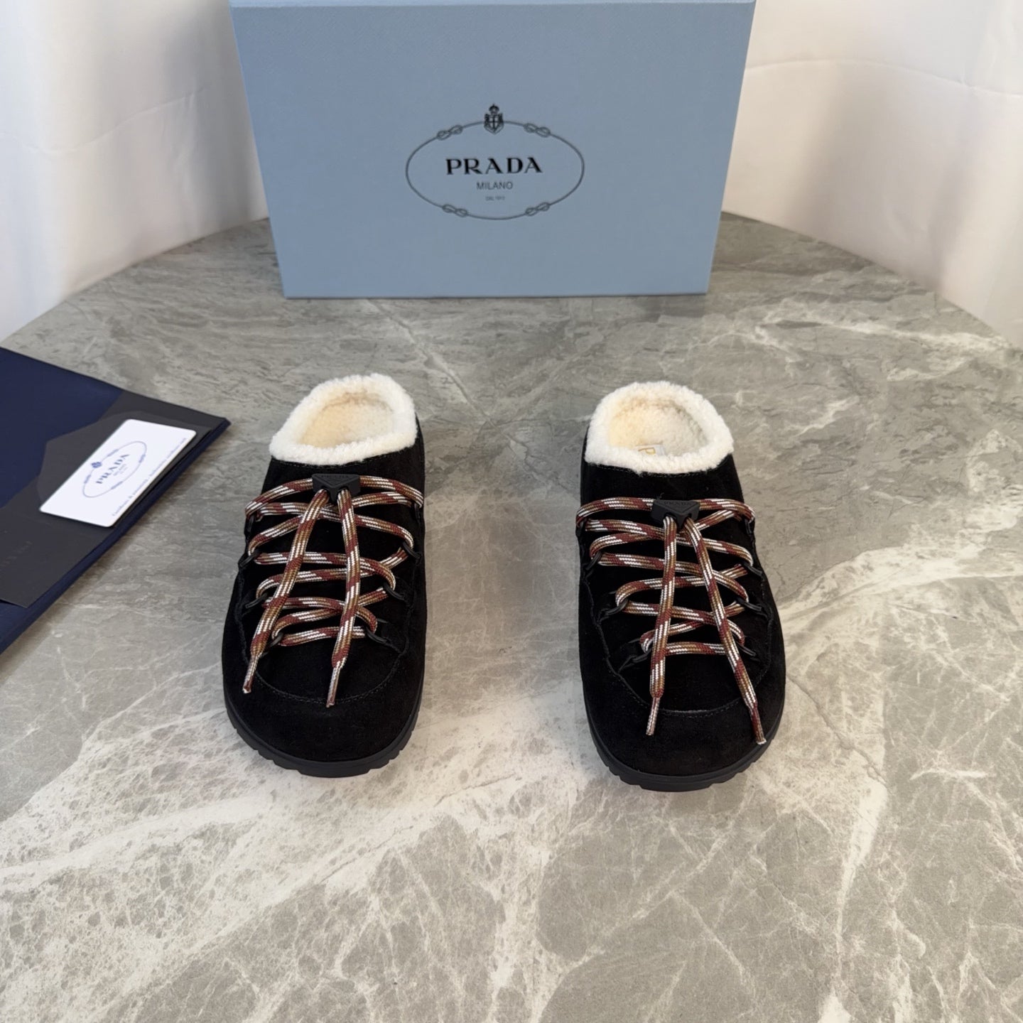 PRADA 26S WOVEN MULES IN BLACK SUEDE