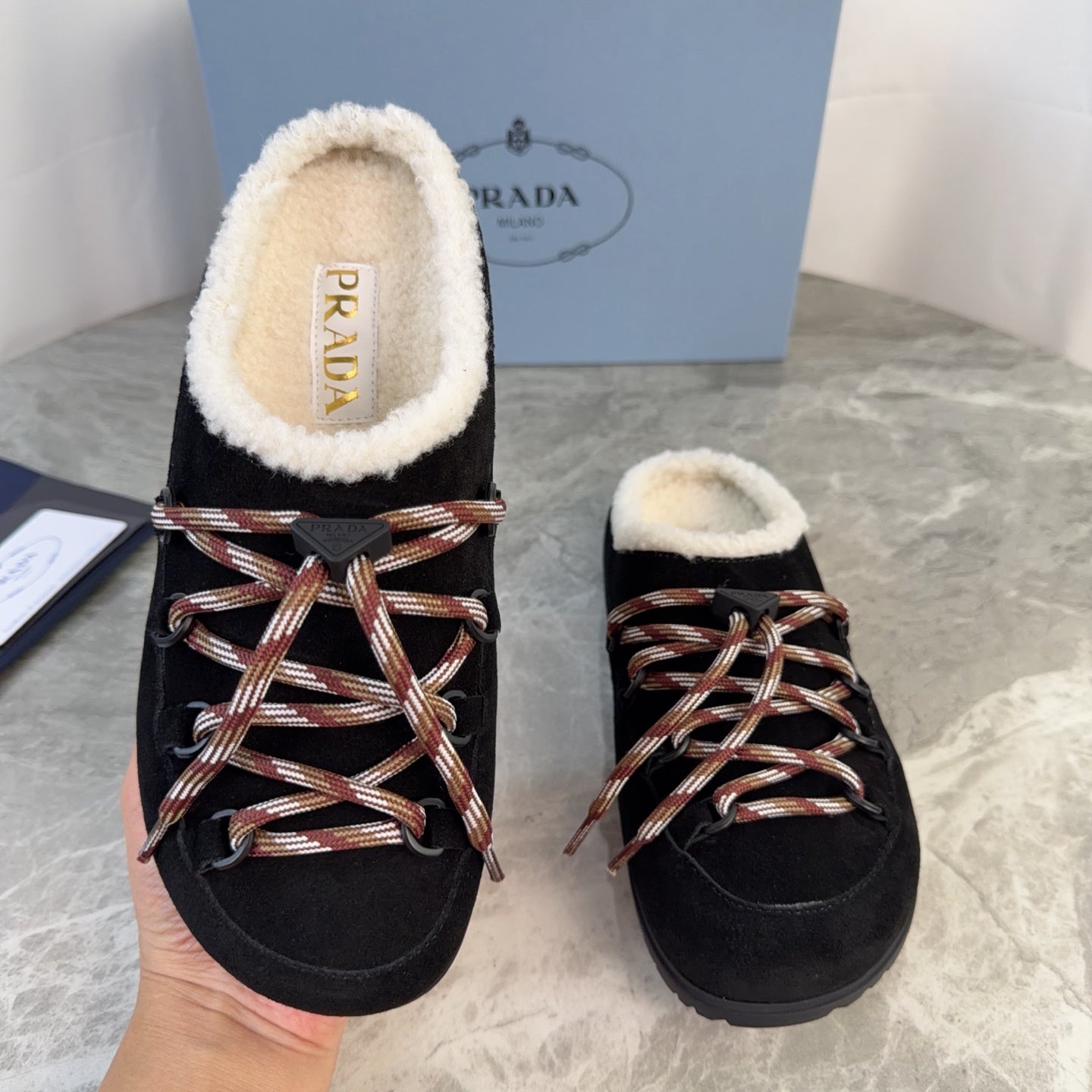 PRADA 26S WOVEN MULES IN BLACK SUEDE