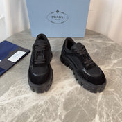 PRADA 26S GEAR SOLE SNEAKERS IN BLACK SUEDE AND MESH