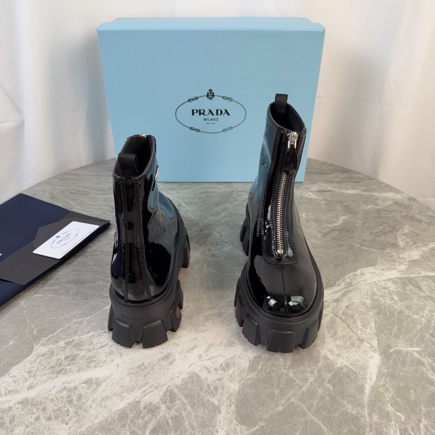 PRADA 26S ZIP-UP ANKLE BOOTS IN BLACK PATENT CALFSKIN