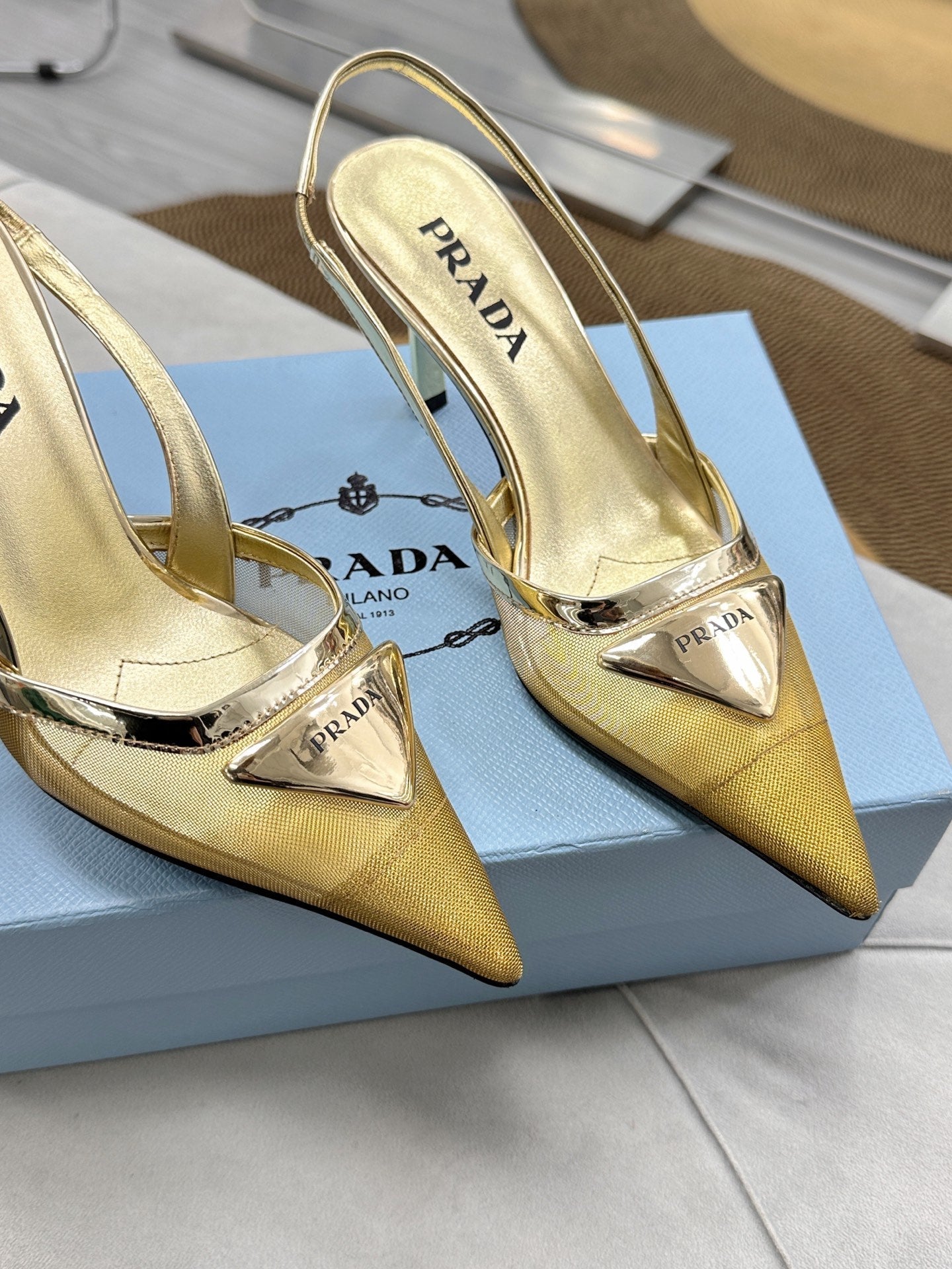 PRADA 25S TRIANGLE LOGO SLINGBACK PUMPS IN GOLD MESH FABRIC
