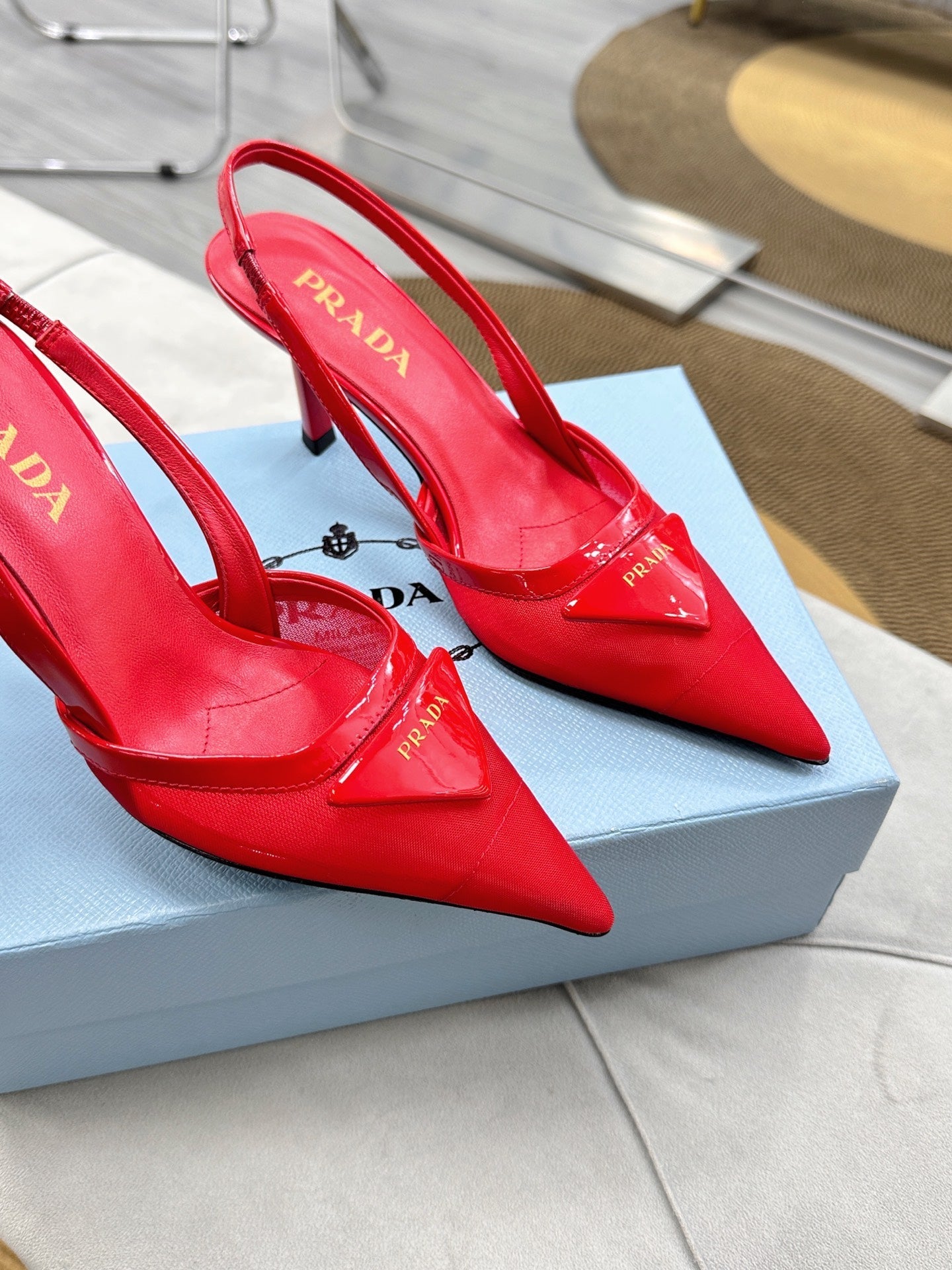 PRADA 25S TRIANGLE LOGO SLINGBACK PUMPS IN RED MESH FABRIC