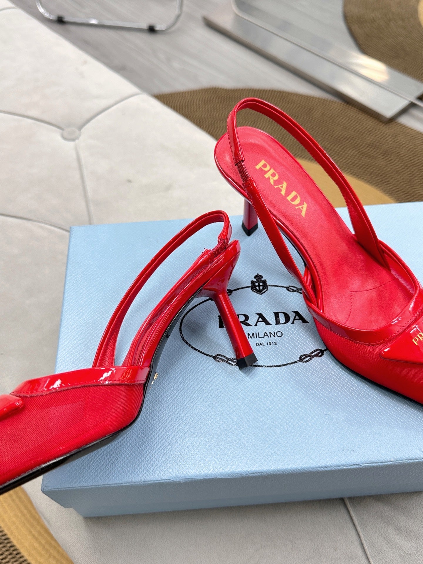 PRADA 25S TRIANGLE LOGO SLINGBACK PUMPS IN RED MESH FABRIC