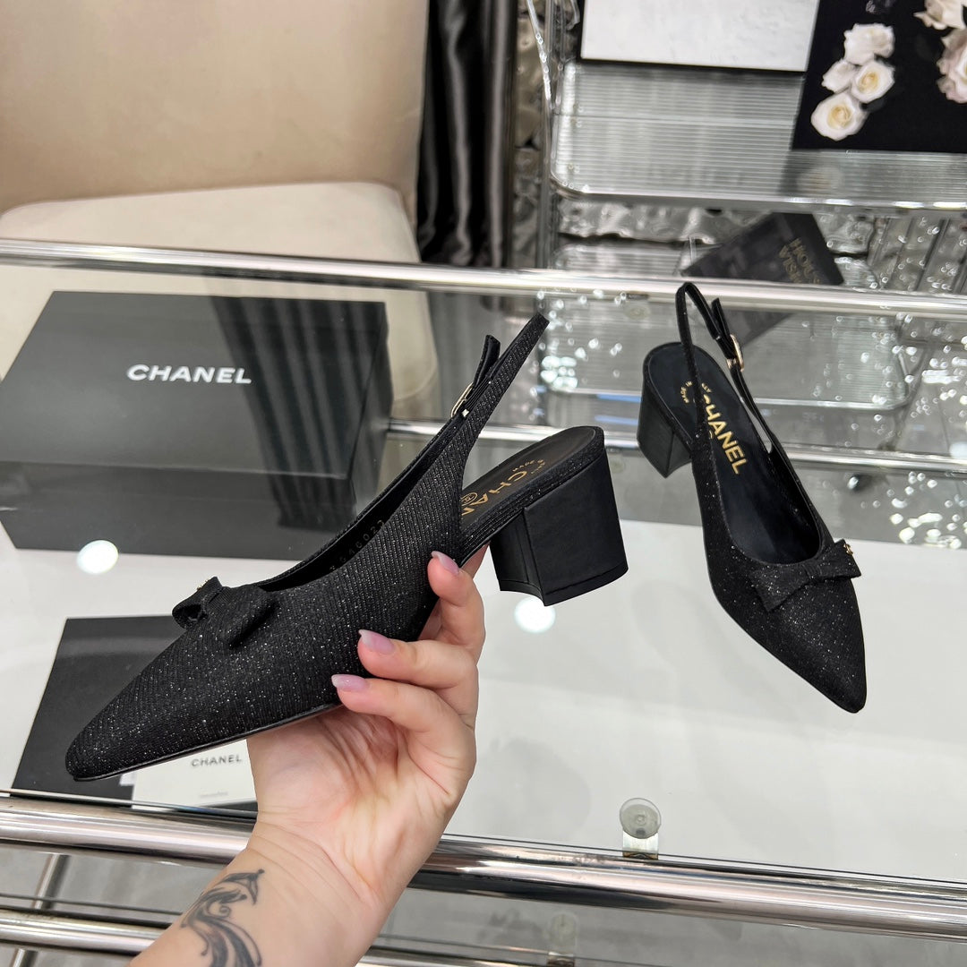 CHANEL 25S SANDALS WITH A BOW 60MM IN SPARKLING BLACK CANVAS
