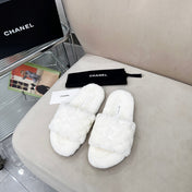 CHANEL 25S FUR SLIPPERS WITH EXPOSED-STITCH STRAPS IN WHITE