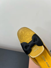 BOW MULES IN DUST YELLOW SUEDE