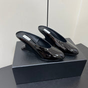 ALAIA WEDGE MULES 25S IN BLACK LAMBSKIN