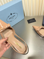 PRADA 26S POINTED-TOE SLINGBACK PUMPS IN BEIGE PATENT CALFSKIN WITH BOW