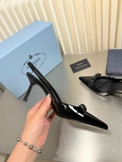 PRADA 26S POINTED-TOE SLINGBACK PUMPS IN BLACK PATENT CALFSKIN WITH BOW
