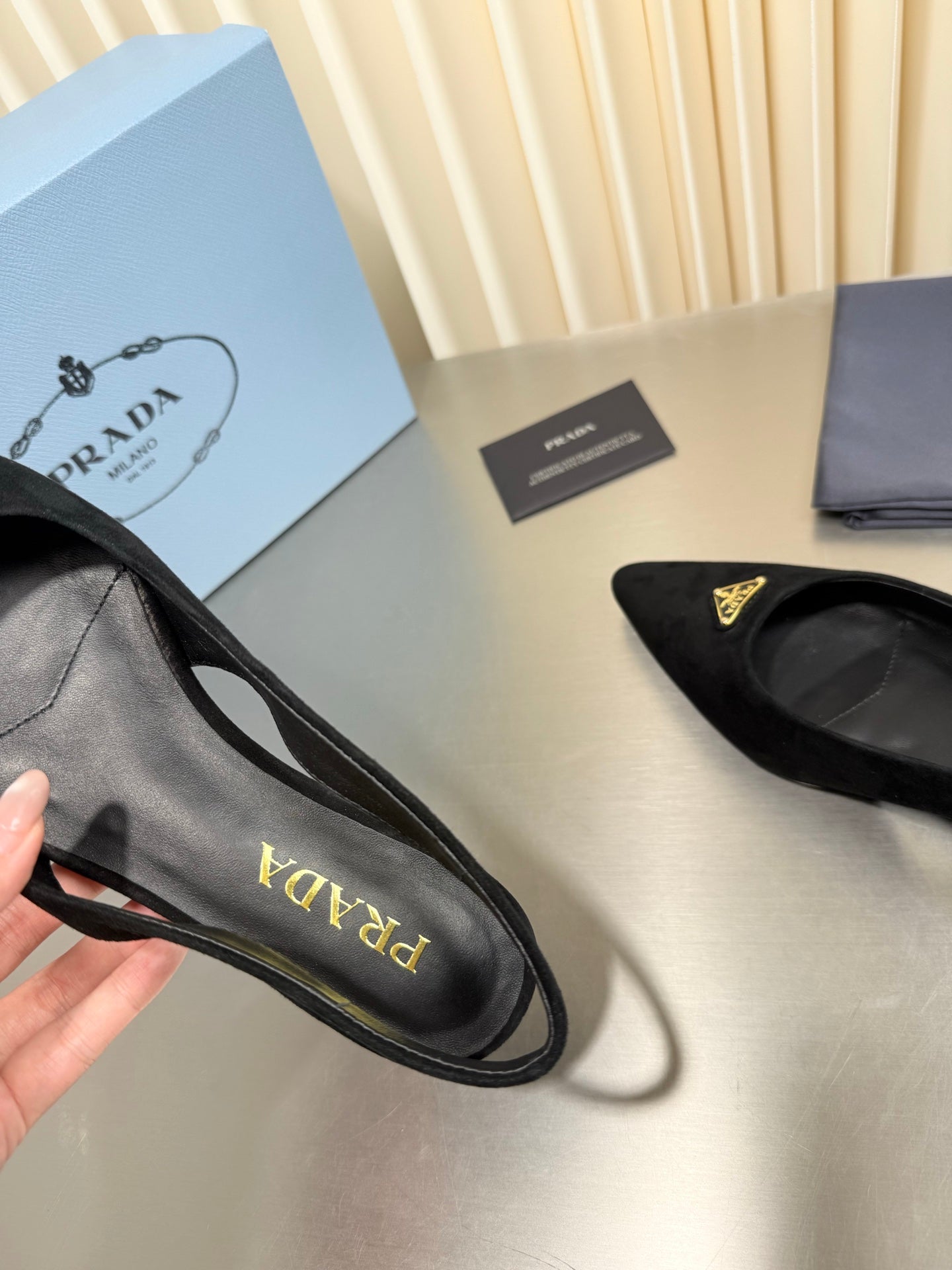 PRADA 26S SLINGBACK FLATS IN BLACK SUEDE WITH GOLD HARDWARE