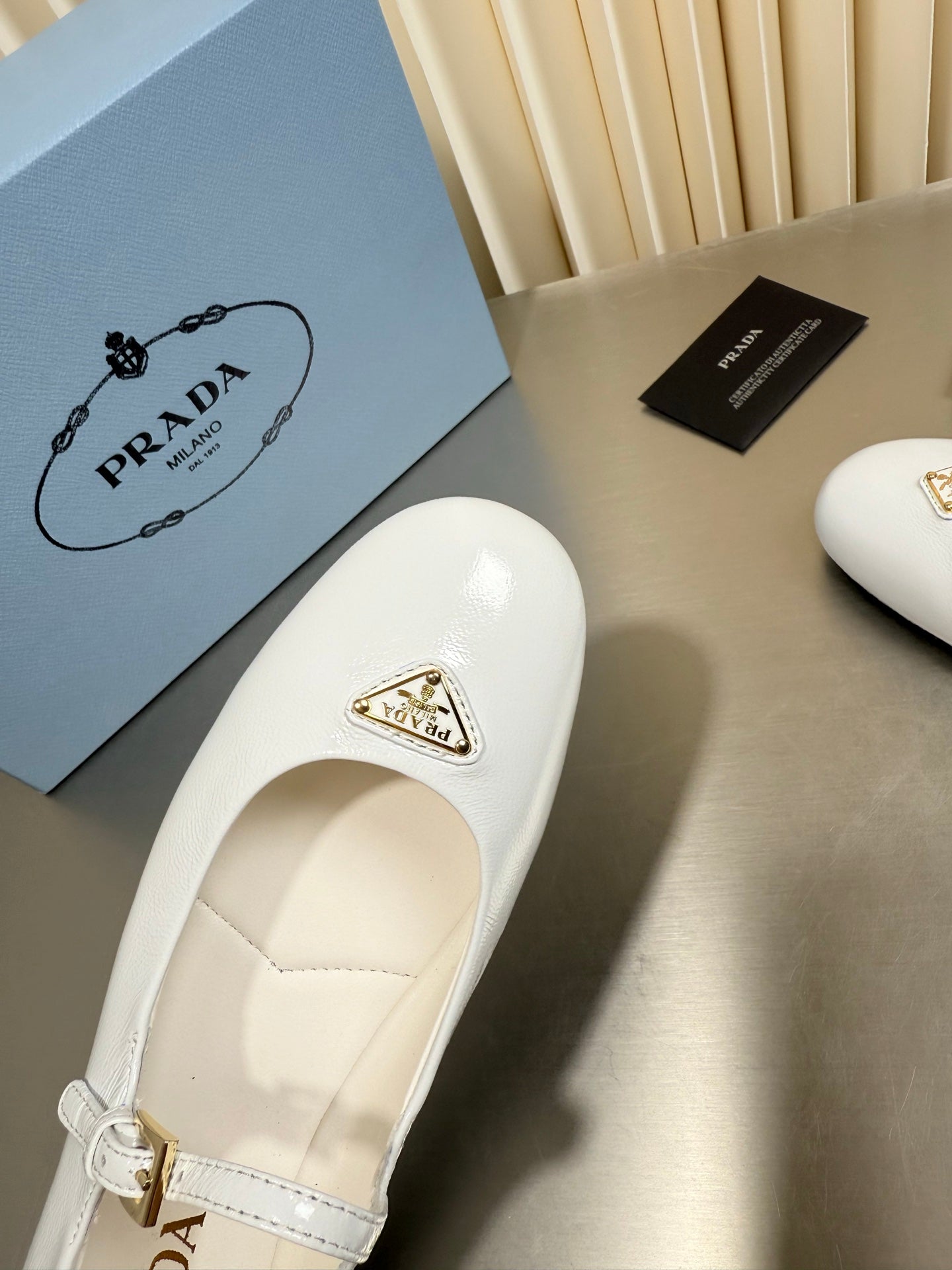PRADA 26S MARY JANE FLATS IN WHITE CALFSKIN
