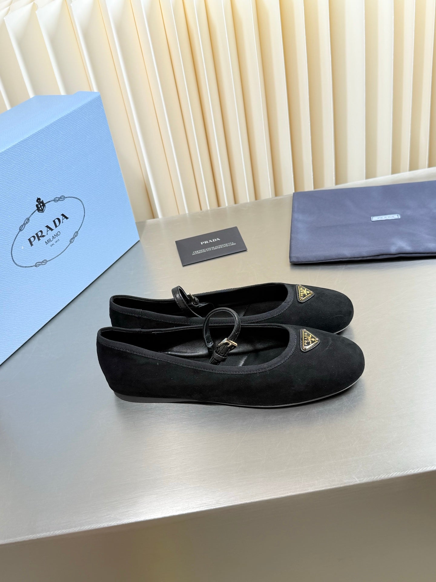 PRADA 26S MARY JANE FLATS IN BLACK SUEDE