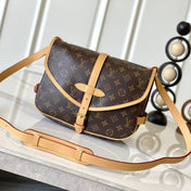 SAUMUR BB 35 IN BROWN MONOGRAM CANVAS AND LEATHER TRIM GOLD HARDWARE