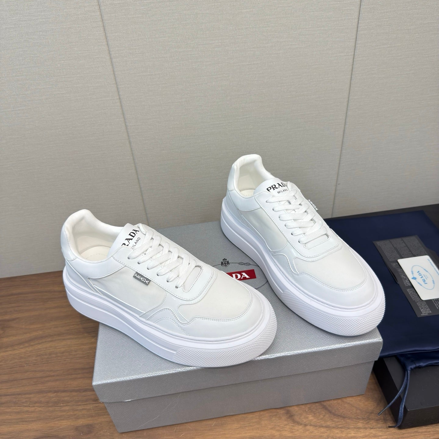 PRADA 25S DOWNTOWN BOLD SNEAKERS 45MM IN WHITE CALFSKIN